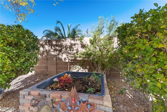 11132 Ferragamo Ct, Las Vegas, NV 89141 - exterior details featuring fence and a garden