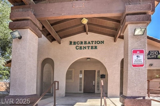 2524 Charleville Ave Unit 102, Las Vegas, NV 89106 - doorway to property featuring a patio area and stucco siding