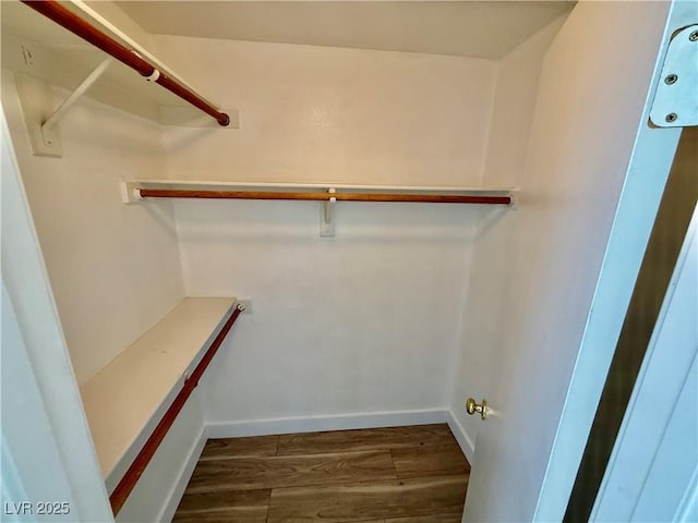 2524 Charleville Ave Unit 102, Las Vegas, NV 89106 - spacious closet with dark wood-style flooring