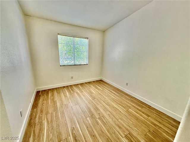 2524 Charleville Ave Unit 102, Las Vegas, NV 89106 - unfurnished room with light wood-style floors and baseboards