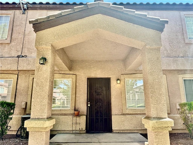2524 Charleville Ave Unit 102, Las Vegas, NV 89106 - doorway to property featuring stucco siding