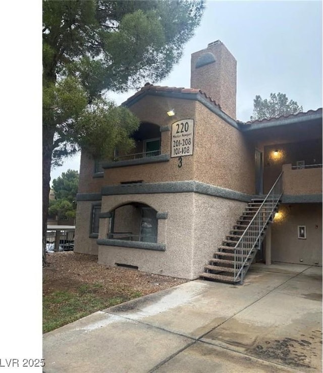 view of property featuring stairs