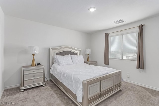 carpeted bedroom featuring baseboards and visible vents