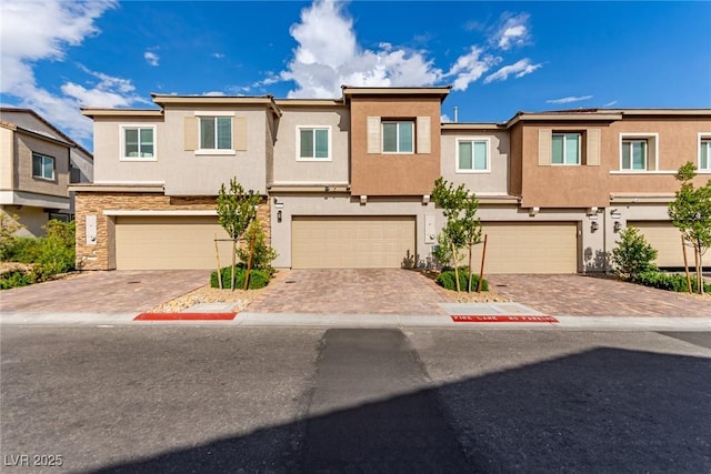 6150 Foxes Dale St, Las Vegas, NV 89166 - multi unit property featuring stucco siding, an attached garage, driveway, and stone siding