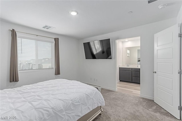 6150 Foxes Dale St, Las Vegas, NV 89166 - bedroom featuring light colored carpet, baseboards, and ensuite bathroom