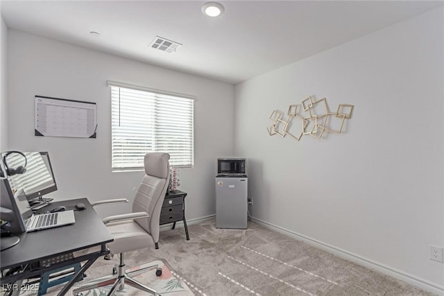 office with carpet, baseboards, and visible vents