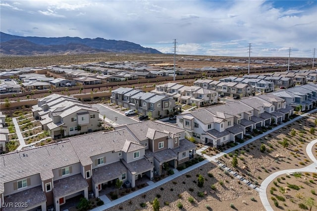 birds eye view of property featuring a mountain view and a residential view