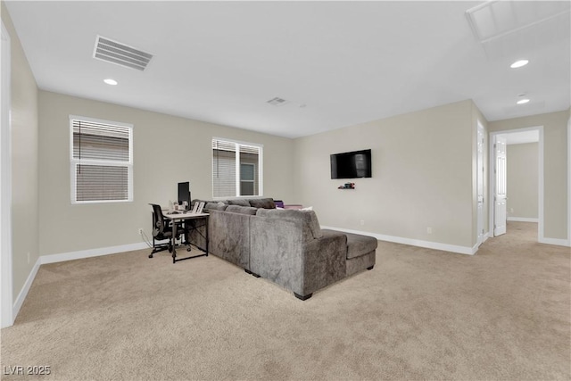 carpeted living area featuring visible vents, baseboards, and recessed lighting