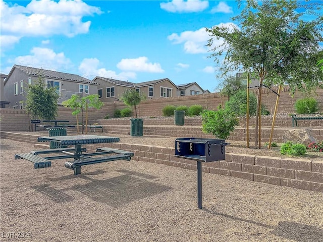 view of property's community with fence