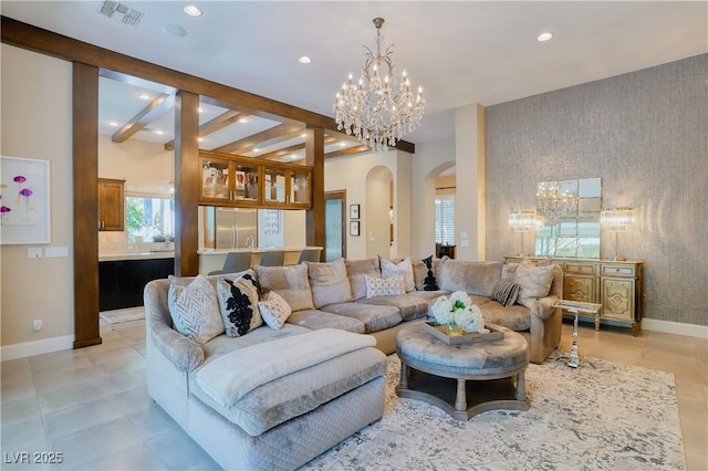9500 Balatta Canyon Ct, Las Vegas, NV 89144 - living room with a chandelier, arched walkways, recessed lighting, baseboards, and wallpapered walls