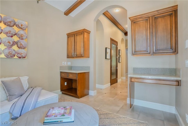 9500 Balatta Canyon Ct, Las Vegas, NV 89144 - bedroom featuring arched walkways, baseboards, beam ceiling, and light tile patterned floors