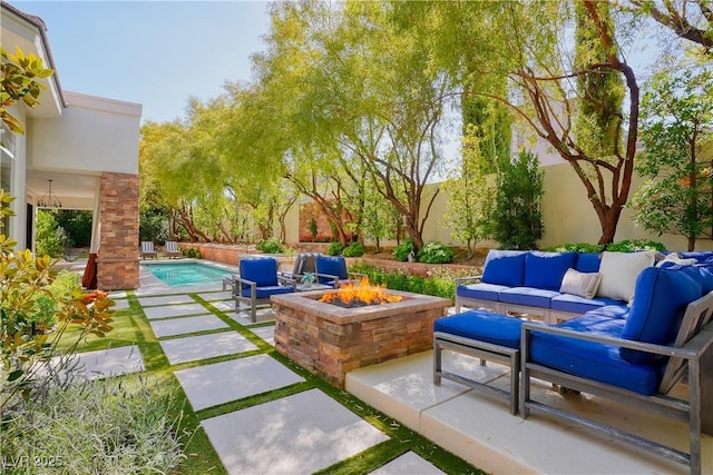 9500 Balatta Canyon Ct, Las Vegas, NV 89144 - fenced backyard featuring an outdoor living space with a fire pit and a patio