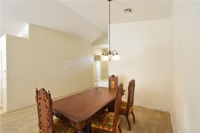 dining space with light carpet, an inviting chandelier, visible vents, and vaulted ceiling