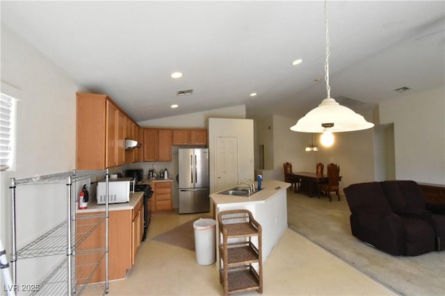 kitchen featuring white microwave, freestanding refrigerator, visible vents, light carpet, and light countertops