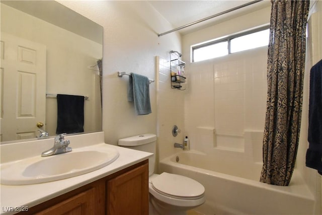 full bath featuring vanity, toilet, and shower / tub combo