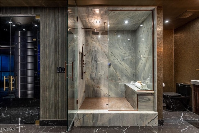 full bathroom with toilet, a marble finish shower, and marble finish floor