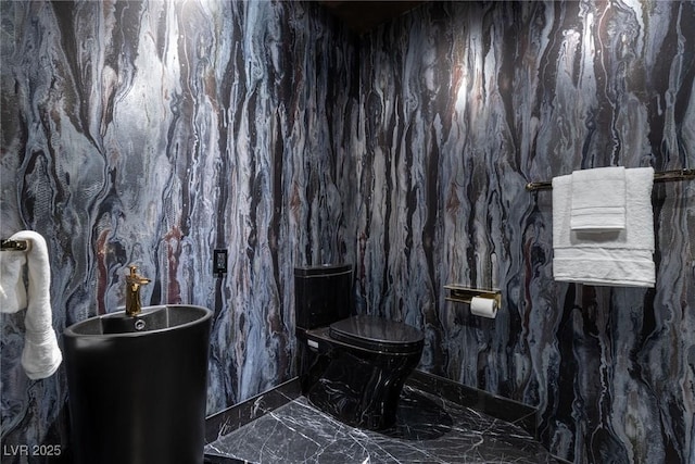 bathroom featuring marble finish floor
