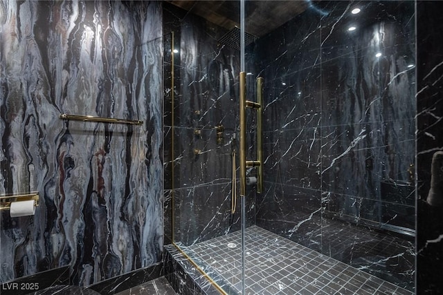 bathroom with a marble finish shower and marble finish floor