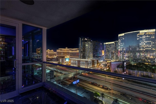 balcony at night with a view of city lights