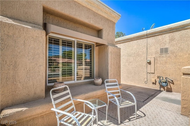 view of patio / terrace featuring visible vents