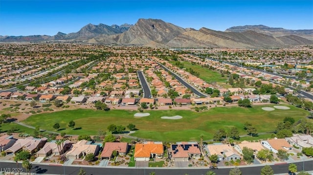 bird's eye view with a mountain view, view of golf course, and a residential view