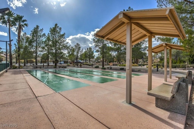 view of swimming pool featuring shuffleboard