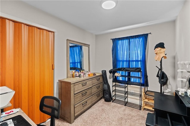 bedroom with light colored carpet