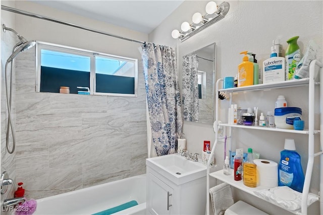 bathroom featuring vanity and shower / bath combination with curtain