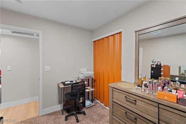 office space featuring light colored carpet and baseboards