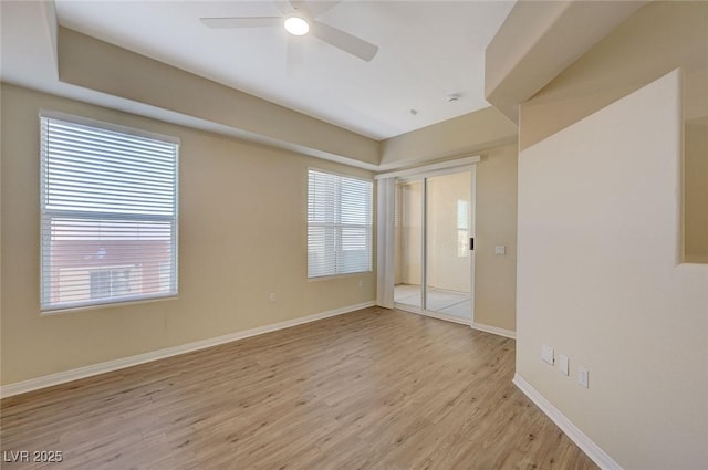50 E Serene Ave Unit 420, Las Vegas, NV 89123 - spare room with plenty of natural light, light wood-type flooring, baseboards, and ceiling fan