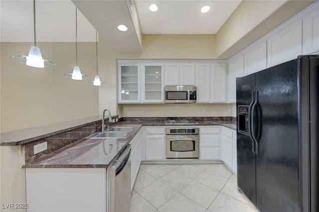 50 E Serene Ave Unit 420, Las Vegas, NV 89123 - kitchen with appliances with stainless steel finishes, a sink, white cabinetry, a peninsula, and recessed lighting