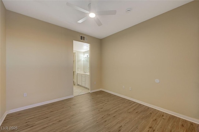 50 E Serene Ave Unit 420, Las Vegas, NV 89123 - empty room featuring light wood-style flooring, a ceiling fan, and baseboards