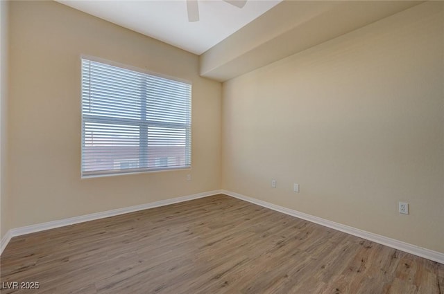 50 E Serene Ave Unit 420, Las Vegas, NV 89123 - empty room with wood finished floors, healthy amount of natural light, ceiling fan, and baseboards