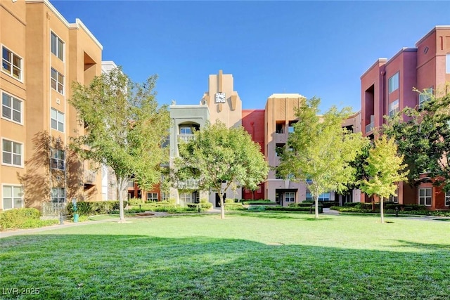 view of home's community with a yard