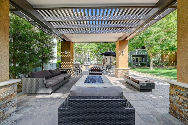 view of patio with an outdoor living space with a fire pit and a pergola