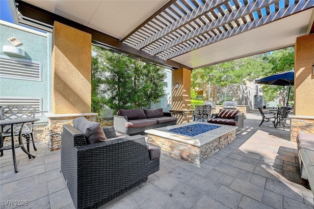 view of patio featuring an outdoor living space with a fire pit, a pergola, and outdoor dining area