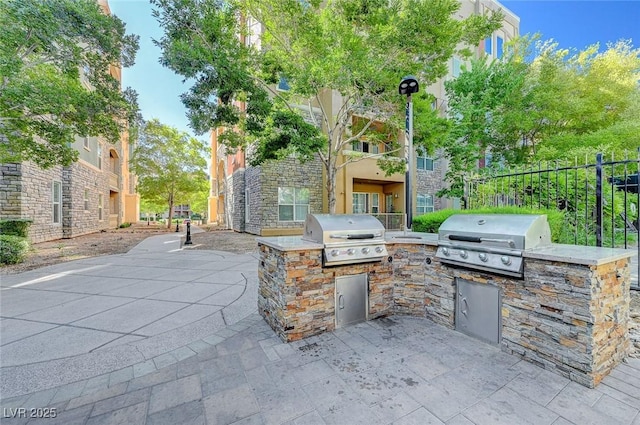 view of patio with area for grilling and grilling area