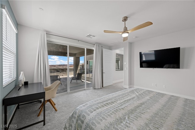 carpeted bedroom featuring baseboards, multiple windows, access to outside, and visible vents