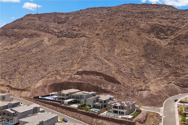 property view of mountains featuring a residential view