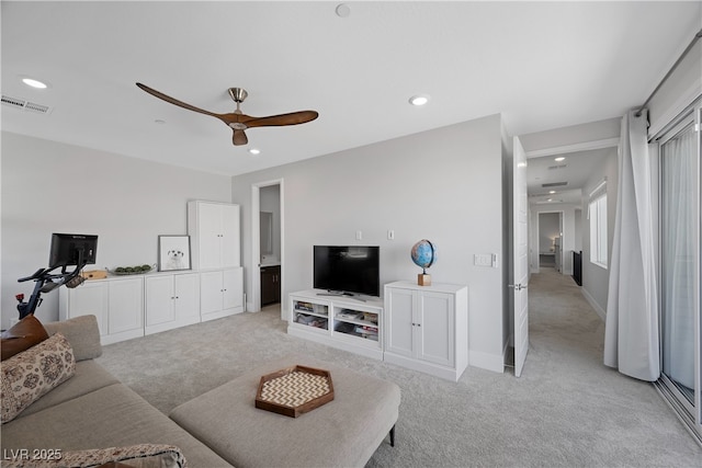 living area featuring ceiling fan, light carpet, recessed lighting, and visible vents