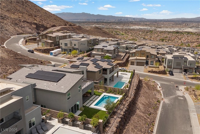 birds eye view of property with a mountain view and a residential view