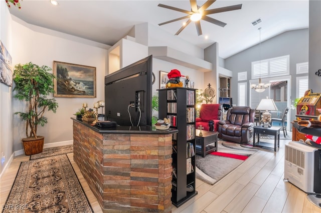welcome area featuring visible vents and ceiling fan with notable chandelier