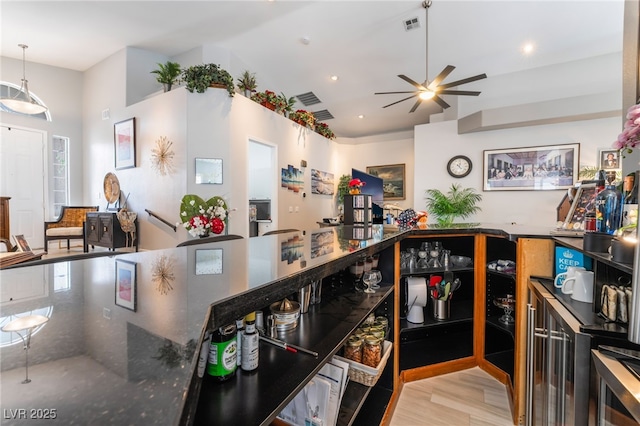 kitchen with recessed lighting, beverage cooler, visible vents, ceiling fan, and light wood-type flooring