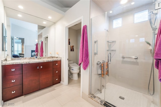 ensuite bathroom with toilet, a stall shower, ensuite bath, vanity, and recessed lighting