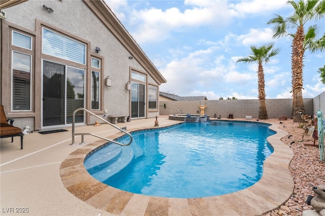view of swimming pool featuring a patio, a pool with connected hot tub, and a fenced backyard