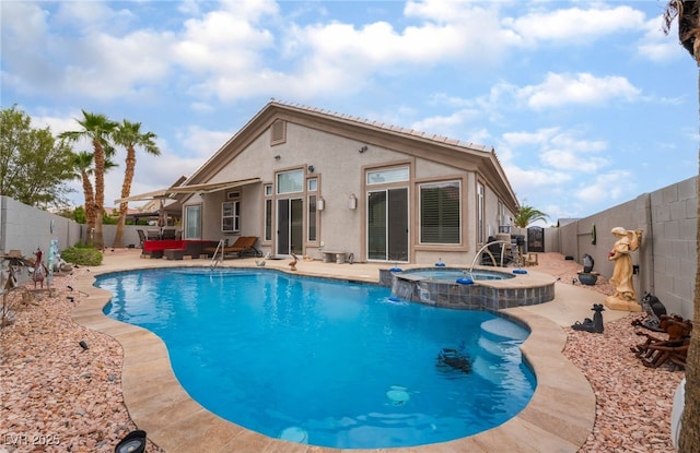 view of swimming pool featuring an in ground hot tub, a fenced in pool, a fenced backyard, and a patio