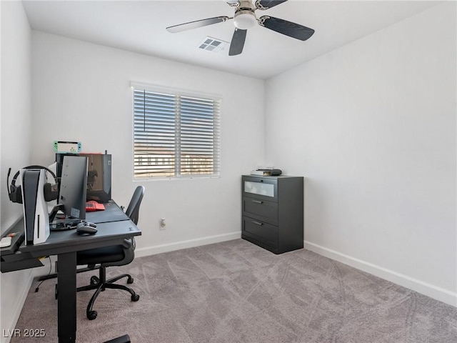 office area featuring ceiling fan, light colored carpet, baseboards, and visible vents