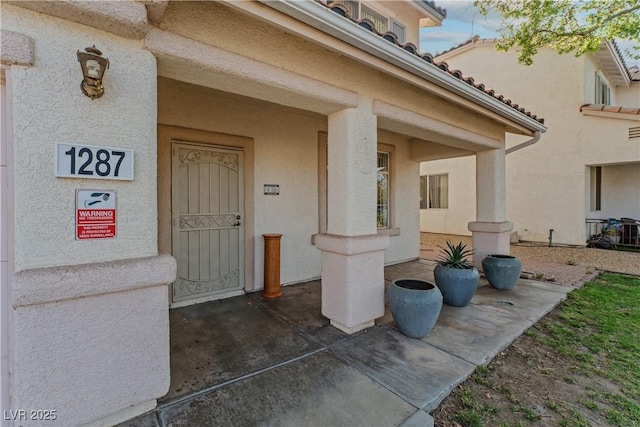 1287 Dove Tree Ct, Henderson, NV 89014 - doorway to property featuring stucco siding
