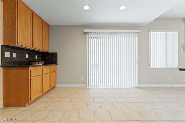 1287 Dove Tree Ct, Henderson, NV 89014 - kitchen with baseboards, backsplash, a healthy amount of sunlight, and recessed lighting