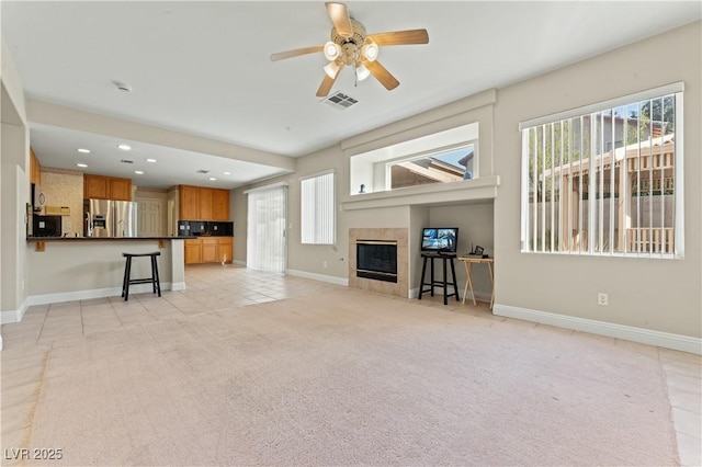 1287 Dove Tree Ct, Henderson, NV 89014 - unfurnished living room with a ceiling fan, recessed lighting, baseboards, visible vents, and light colored carpet